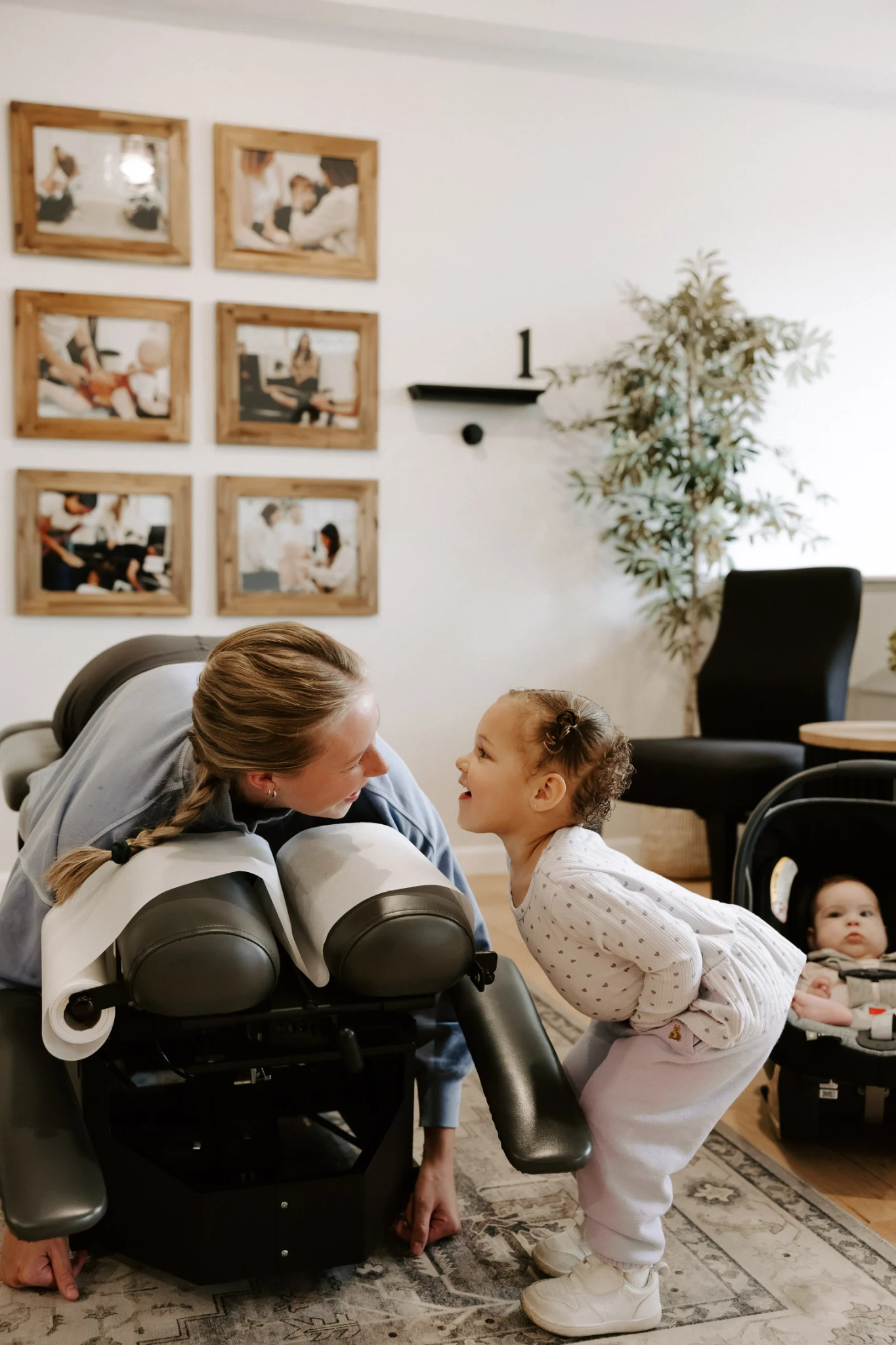Mother receiving postpartum support at Wellhouse Chiropractic