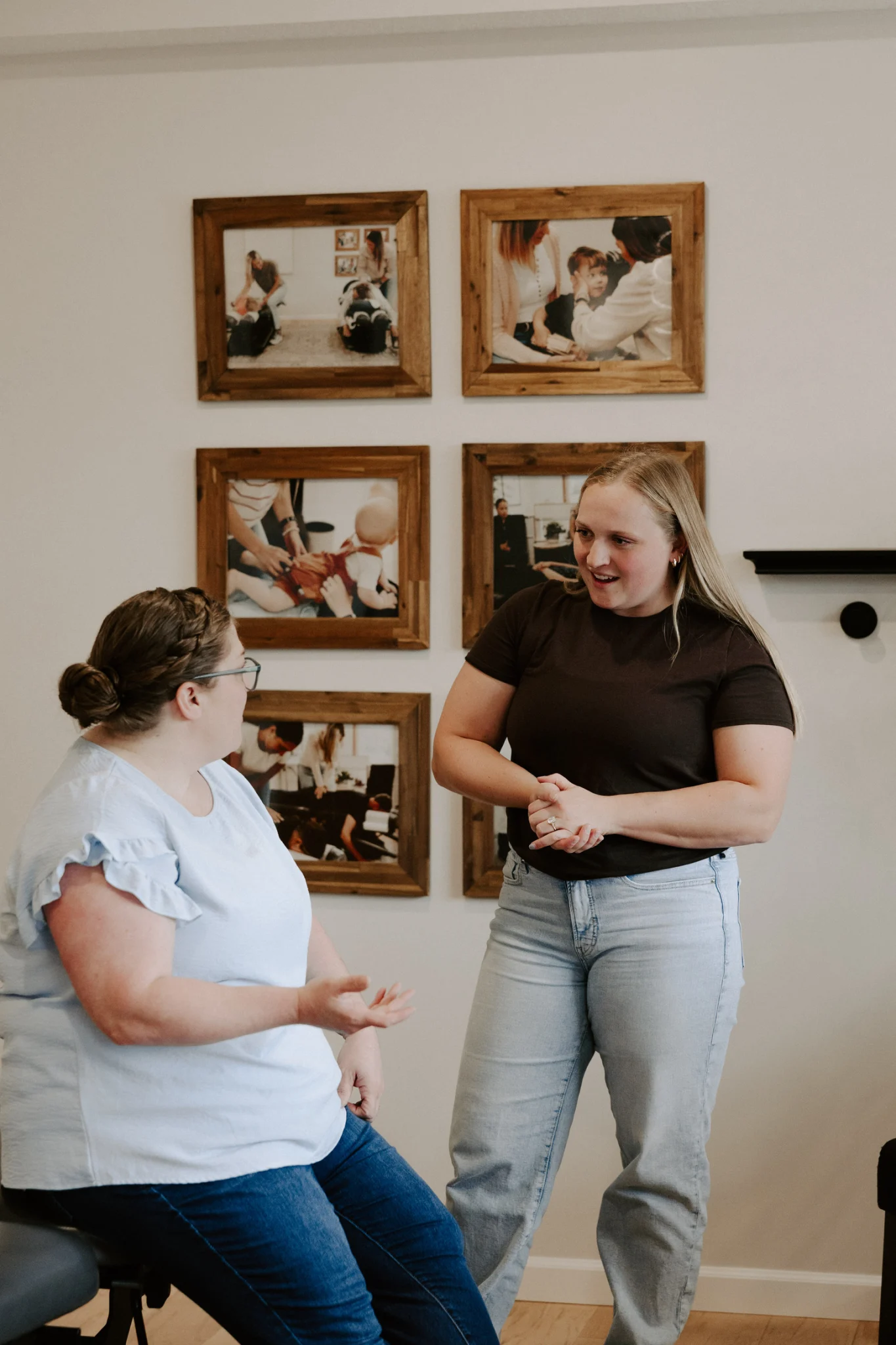 Wellhouse chiropractor talking with a parent