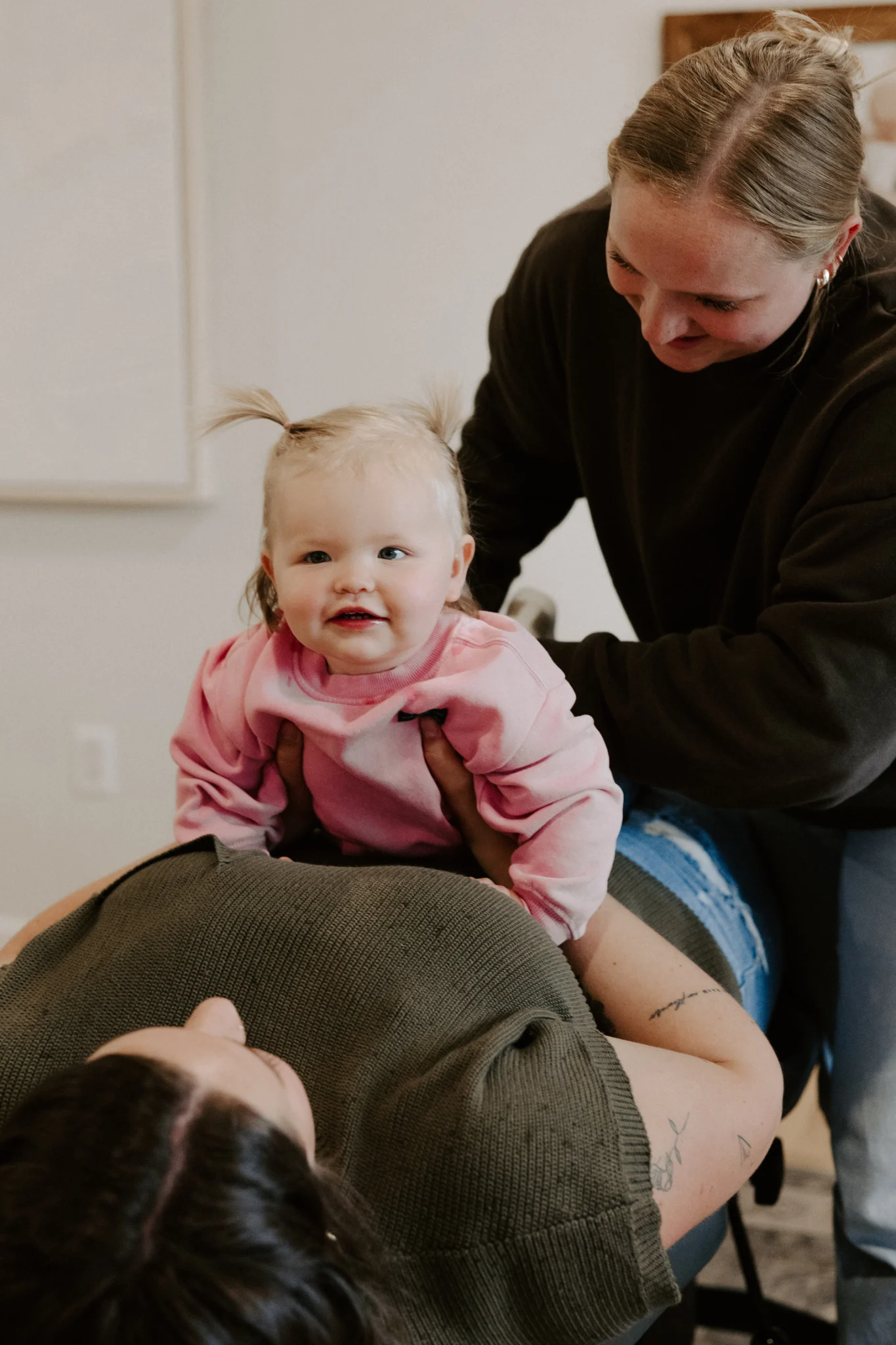 Infant receiving gentle chiropractic care at Wellhouse Chiropractic